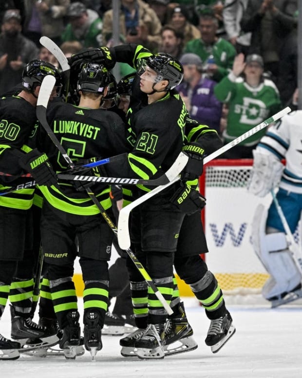 Nov 11, 2022; Dallas, Texas, USA; Dallas Stars defenseman Ryan Suter (20) and defenseman Nils Lundkvist (5) and left wing Jason Robertson (21) and center Roope Hintz (24) celebrates a goal scored by Hintz against the San Jose Sharks during the third period at American Airlines Center. Mandatory Credit: Jerome Miron-USA TODAY Sports